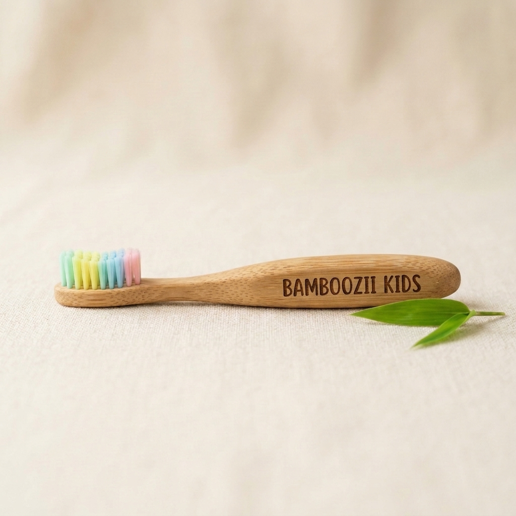 Bamboozii kids bamboo toothbrush with extra-soft bristles and a small handle on a cream background