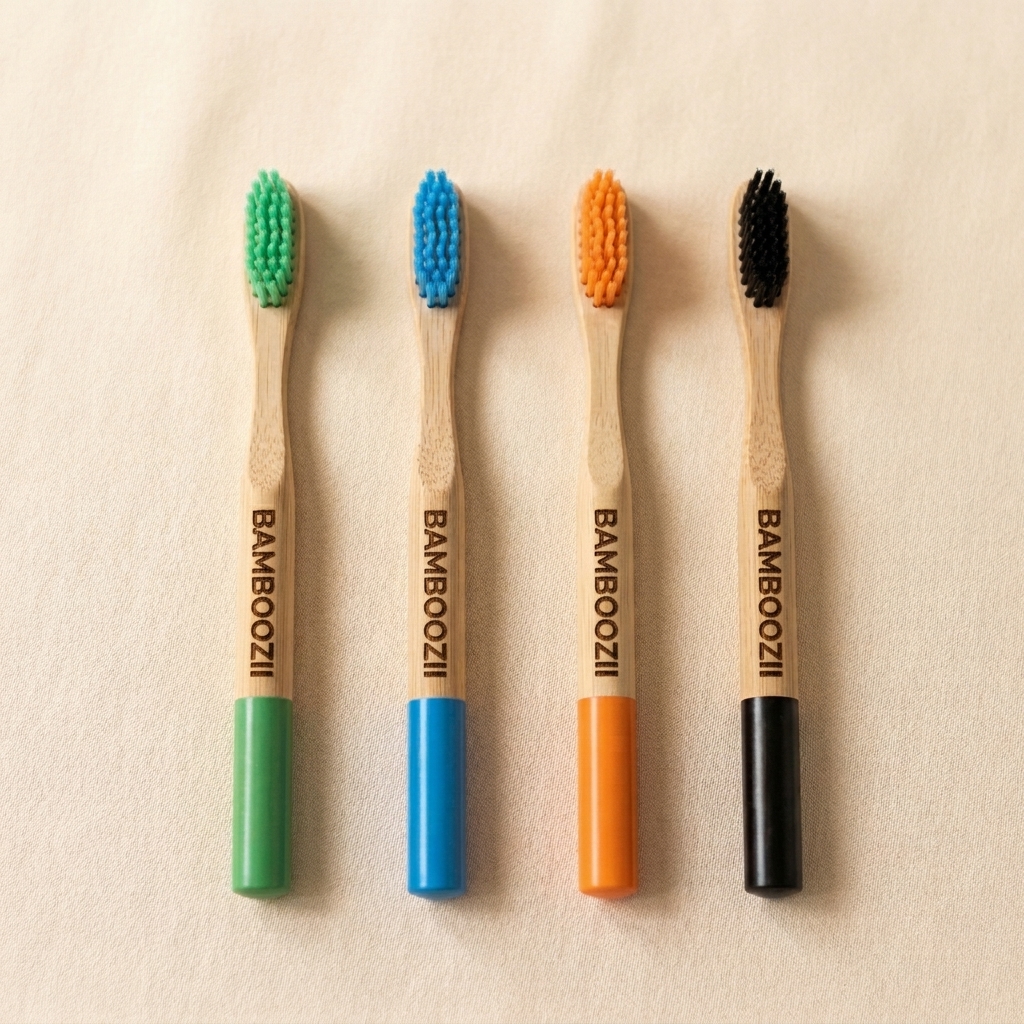 Bamboozii family pack of four bamboo toothbrushes with green, blue, orange and black colour-coded bristles
