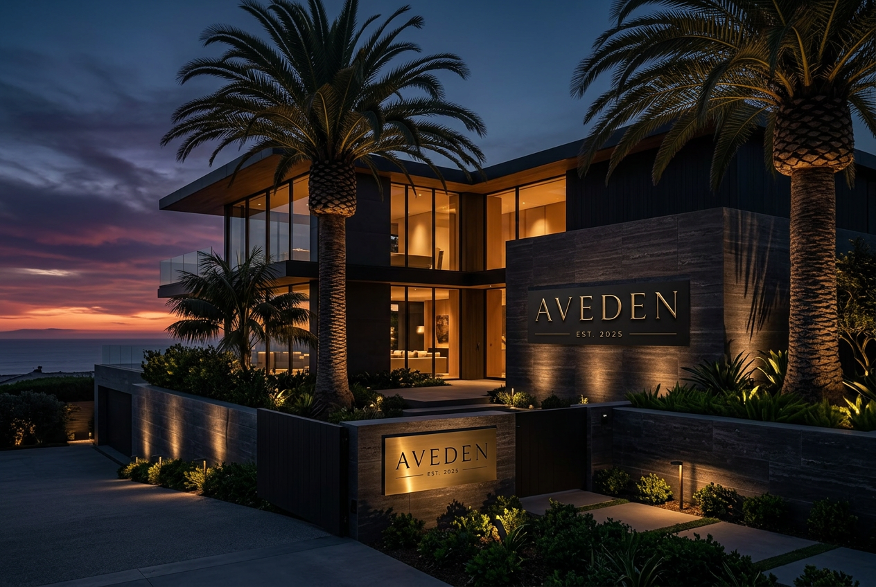 Modern coastal family office at dusk overlooking the Pacific Ocean